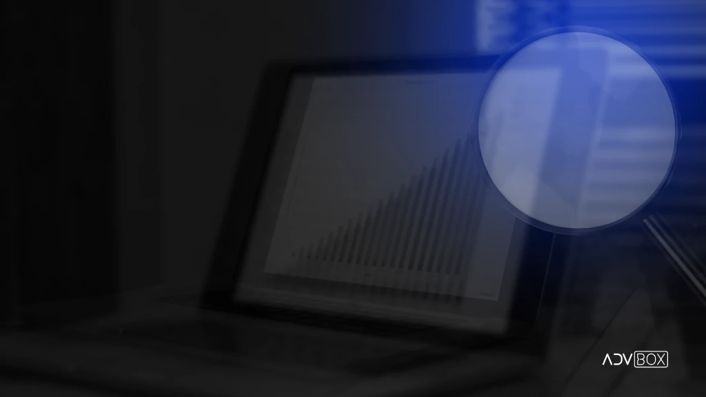 computador com graficos e uma lupa sobreposta montar um setor comercial